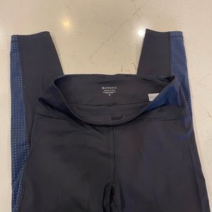 Athleta Ultimate 7/8 tight. Black and navy detail.